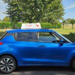 practical driving test car blue with vogue signage