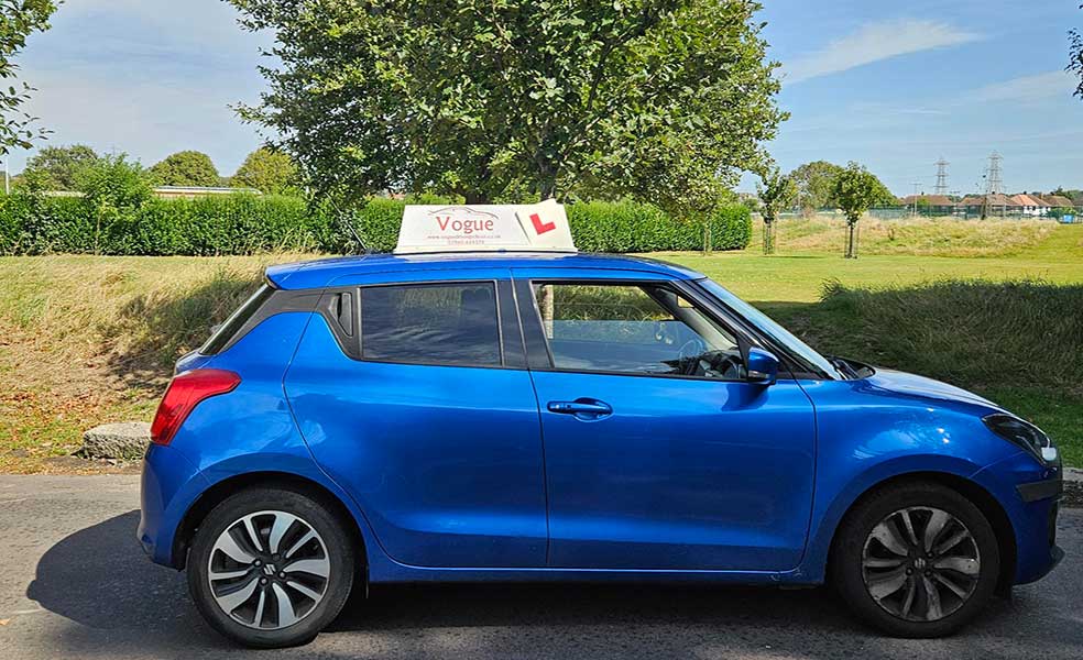 practical driving test car blue with vogue signage